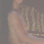 Denia Psyllia briefly topless